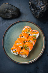 Philadelphia rolls with shrimp, salmon, avocado, Philadelphia cheese, nori, rice with mango sauce.