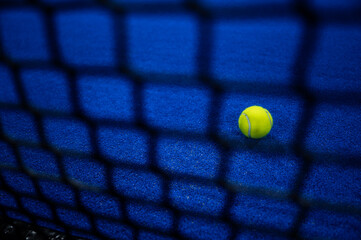 Padel ball behind the net