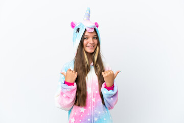 Little caucasian girl wearing unicorn pajama isolated on white background with thumbs up gesture...