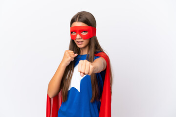 Little caucasian girl isolated on white background in superhero costume and fighting
