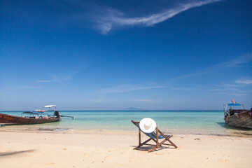 beautiful tropical beach in Thailand with longtail boats