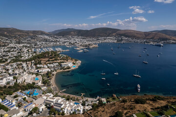 Obraz premium Spectacular view from drone of beautiful yachts filled with Bodrum harbor and ancient citadel in Muğla province of Turkey