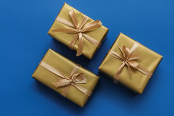 Beautiful Christmas gifts on blue background