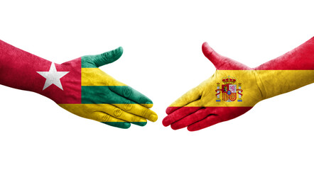 Handshake between Spain and Togo flags painted on hands, isolated transparent image.