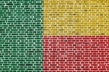 Flag of Benin painted on a brick wall