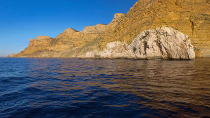 Fototapeta na wymiar Sierra Helada cliffs and Mitjana island from the sea, Benidorm, Alicante province, Spain
