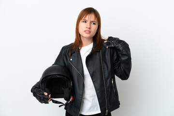 Redhead girl with a motorcycle helmet isolated on white background suffering from pain in shoulder for having made an effort