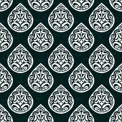 White vintage floral ornamental design on dark blue background.A pattern of petal or water drop shapes in a diagonal arrangement.Vector seamless pattern.The motif design of fabric, clothing,wallpaper.