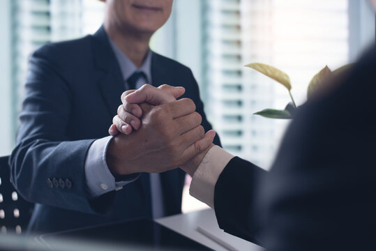 Business partners shaking hands to commitment greeting start up new project or complete mission successful deal together with strong business teamwork. startup concept