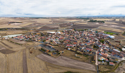 Aerial view of the Spanish town of Adanero in Avila, with its lagoon in the foreground.