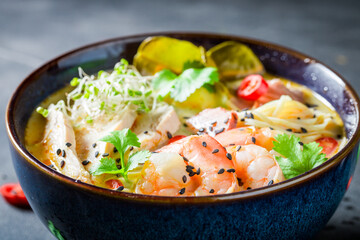 Tasty Malaysian Soup with prawns and chicken.