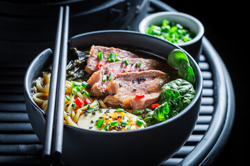Tasty and hot Ramen soup with spinach and noodles.