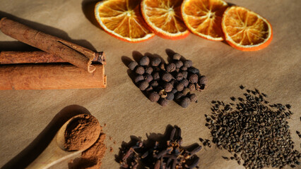 Close up of spices for winter dishes. Aromatic spices for mulled wine or ingredients for seasonal Christmas baking .         