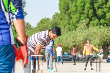 local people playing cricket sport