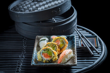 Aromatic na fresh sushi set made of rice and shrimps.