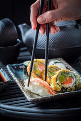 Fresh and colorful sushi set served with wasabi.