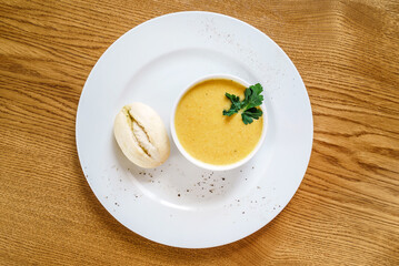 pumpkin cream soup on wooden table