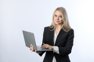 Portrait of young beautiful blonde businesswoman smiling with laptop on white background