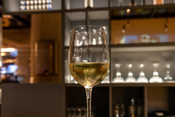 glass of wine on bar counter