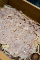 Steam thin piece of meat in box ready to eat. Close up