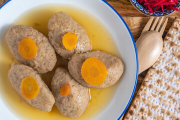 Gefilte fish served with carrot for Jewish holiday Pesach or Passover.