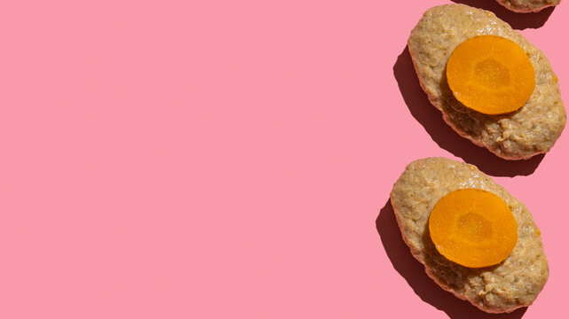 Gefilte fish is must-have dish for Jewish holiday Rosh Hashanah and Pesach (Passover) on pink background with copy space.