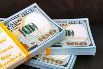 A large amount of cash in bundles of large bills at close range