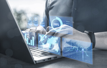 Businessman working with laptop and virtual screen with graphs of financial and economic indicators. Project Manager Researching Process. Innovation Graphs Interfaces