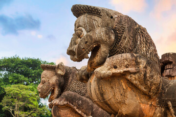 Fototapeta na wymiar Ancient stone lion sculptures at the gateway of Konark Sun Temple at Puri, Odisha, India