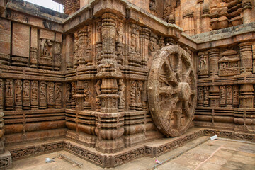 Ancient stone carvings at Konark Sun temple at Pur depicting the chariot of Sun god with a giant...