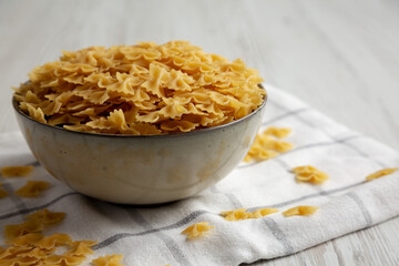 Dry Italian Mini Farfalle Pasta Ready to Cook. Close-up.