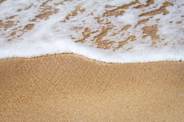 Fototapeta na wymiar Sand beach and waves