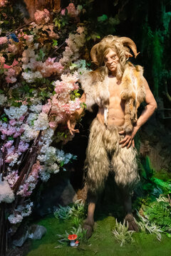Sculpture of faun among flowers in Bestiary Museum - St. Petersburg, Russia, October 2022