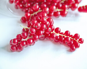 Group of red and wet currants on a white background