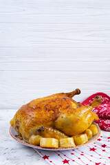 Roasted chicken and potato with Christmas decoration. Traditional food for Christmas or Thanksgiving day