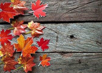 Naklejka na ściany i meble red maple leaves on wood background