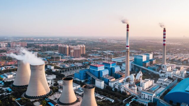 Aerial timelapse photography of a coal-fired thermal power plant at dusk in Hohhot, Inner Mongolia, China
