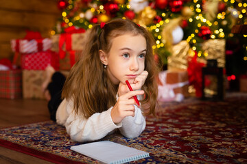 A child's letter to Santa on the eve of a Happy New Year. Template, blank, postcard. A cute girl...