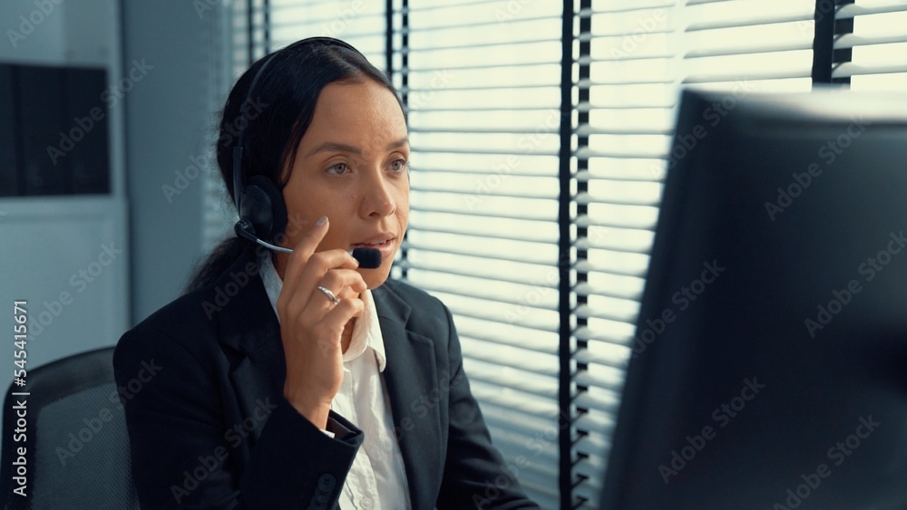 Poster competent female operator working on computer and talking with clients. concept relevant to both cal
