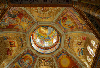 Fototapeta na wymiar POCHAIV, UKRAINE: Lavra Orthodox Christian Monastery Complex Transfiguration Cathedral Interior Cupola Ceiling Fresco of God Jesus Christ