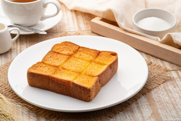 Air fryer grilled butter toast,golden brown crispy bread on white plate