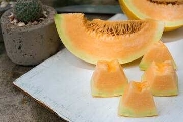 sliced of melons, fresh Melon or cantaloupe, Cantaloupe melons on wood background, Favorite fruit in summer