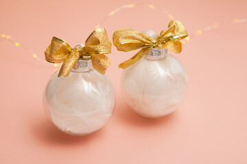 christmas balls-Modern set of glass decorations with white feathers. New Year's Pearl, pink, gold