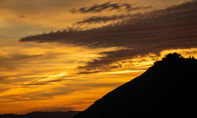 Spectacular cloudy sunset over the Sierra Elvira mountains (Granada, Spain) in autumn