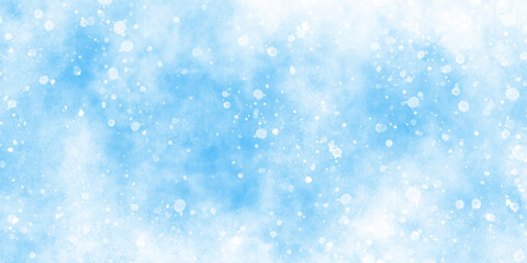 Abstract cloudy blue background with snowflakes, beautiful blue watercolor background with glitter particles, light blue bokeh background for wallpaper, invitation, cover and design.