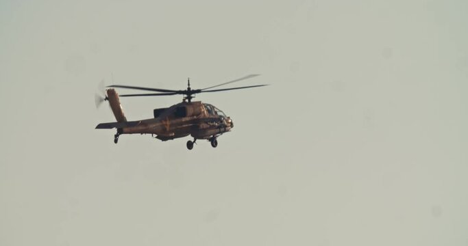 Apache Longbow military helicopter during combat flight