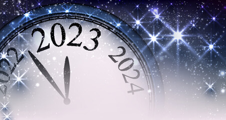 Fototapeta na wymiar Half hidden clock showing 2023 with stars.
