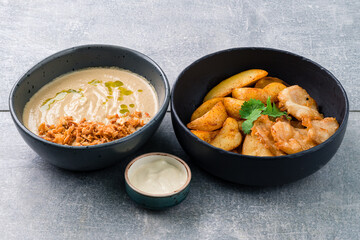 Lunch mushroom cream soup and fish with chips