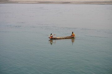 Boat fishing in the river by net