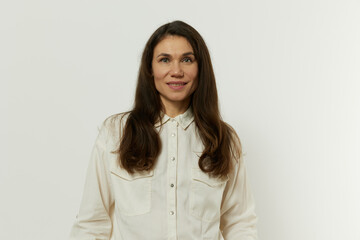 Obraz premium portrait of a beautiful happy attractive adult woman in a white shirt on a white background
